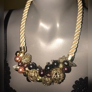 Gold rope necklace with charms